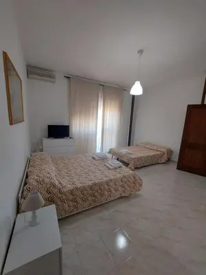 Letto o letti in una camera di Domus Dejanas - Appartamento 180 mq a Quartu