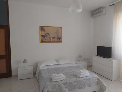 Letto o letti in una camera di Domus Dejanas - Appartamento 180 mq a Quartu