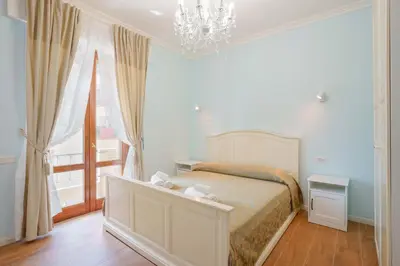 Letto o letti in una camera di Al Teatro Lirico