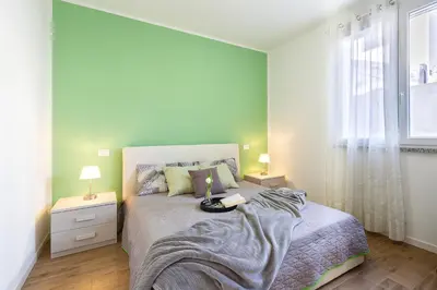 Letto o letti in una camera di Casa Olivastro Millenario A