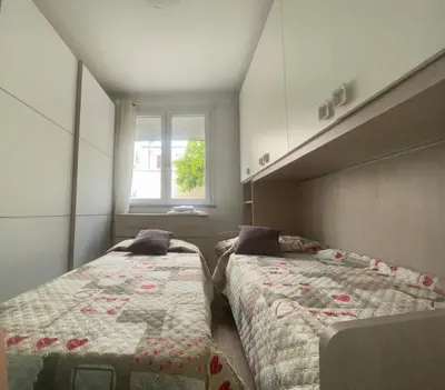 Letto o letti in una camera di Casa Olivastro Millenario A