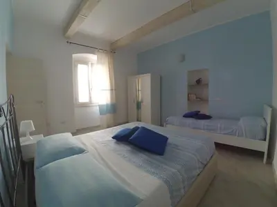 Letto o letti in una camera di Alemar Casa Vacanze
