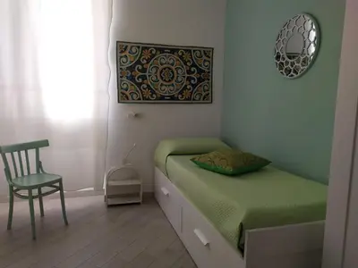 Letto o letti in una camera di Alemar Casa Vacanze