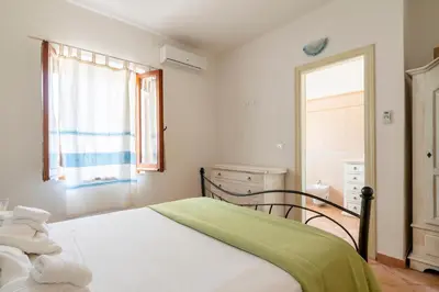 Letto o letti in una camera di Appartamento al mare Via delle Mimose