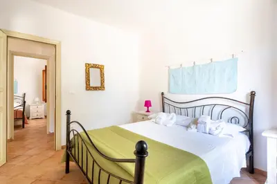 Letto o letti in una camera di Appartamento al mare Via delle Mimose