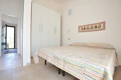 Letto o letti in una camera di Casa Bianco Navarrese B