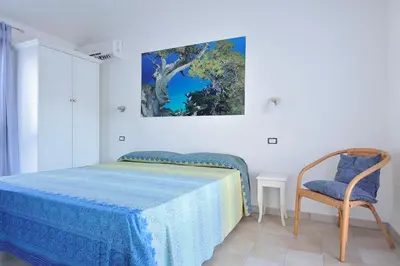 Letto o letti in una camera di Casa Bianco Navarrese A
