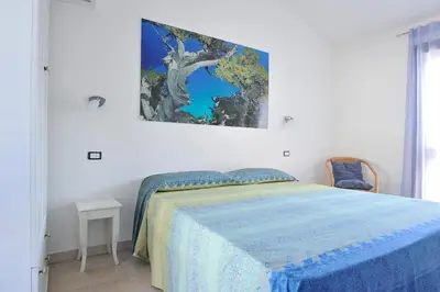 Letto o letti in una camera di Casa Bianco Navarrese A