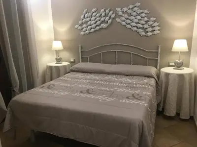 Letto o letti in una camera di Domu de Bisu