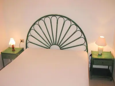 Letto o letti in una camera di Apartments Costa Rei, Costa Rei
