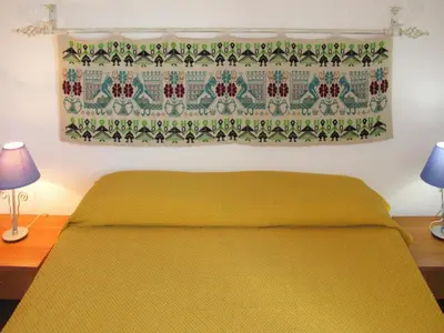 Letto o letti in una camera di Apartments Costa Rei, Costa Rei