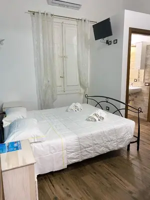Letto o letti in una camera di Dani's House - affittacamere nel cuore di Cagliari