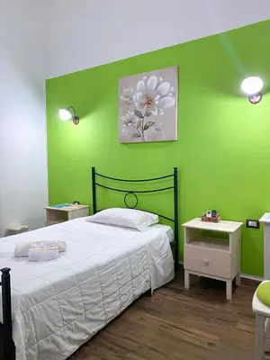 Letto o letti in una camera di Dani's House - affittacamere nel cuore di Cagliari