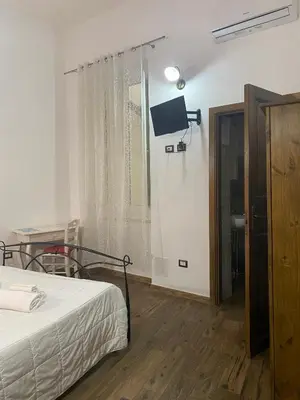 Letto o letti in una camera di Dani's House - affittacamere nel cuore di Cagliari