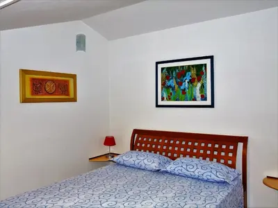 Letto o letti in una camera di Appartamento Oristano città
