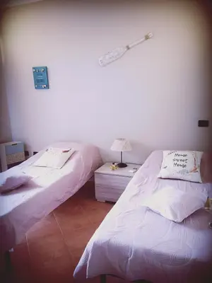 Letto o letti in una camera di Casa Sù Flamingo