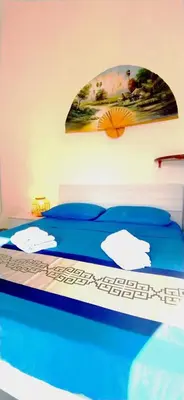 Letto o letti in una camera di Villa Acquamarina Villasimius