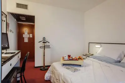 Letto o letti in una camera di Hotel Quadrifoglio