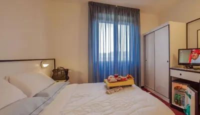 Letto o letti in una camera di Hotel Quadrifoglio