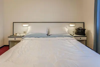 Letto o letti in una camera di Hotel Quadrifoglio