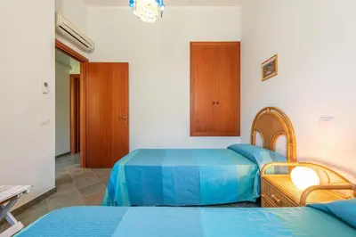Letto o letti in una camera di casa con vista a Chia