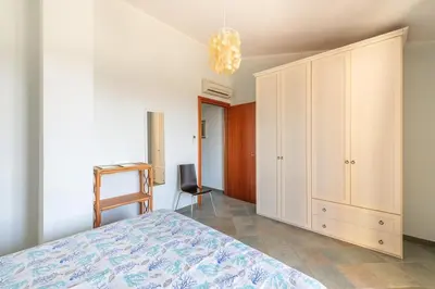Letto o letti in una camera di casa con vista a Chia
