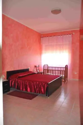 Letto o letti in una camera di B&B Il Gabbiano