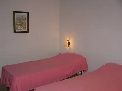 Letto o letti in una camera di Bamboo House