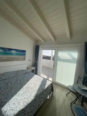 Letto o letti in una camera di Calasetta casa al mare