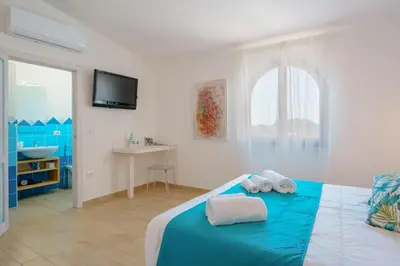 Letto o letti in una camera di B&B Villamarina42