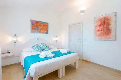 Letto o letti in una camera di B&B Villamarina42