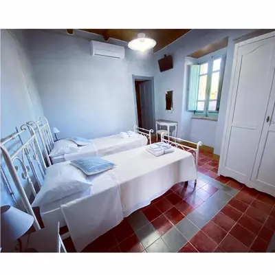 Letto o letti in una camera di B&B Su Strintu