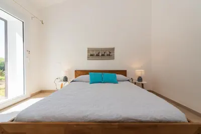 Letto o letti in una camera di B&B BITHIA