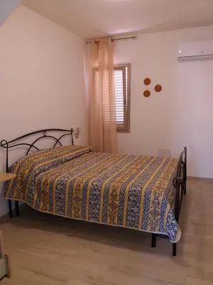 Letto o letti in una camera di Casa Vacanze La Pintadera