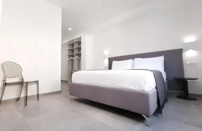 Letto o letti in una camera di Suites Garibaldi