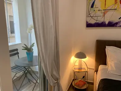 Letto o letti in una camera di Suites Garibaldi