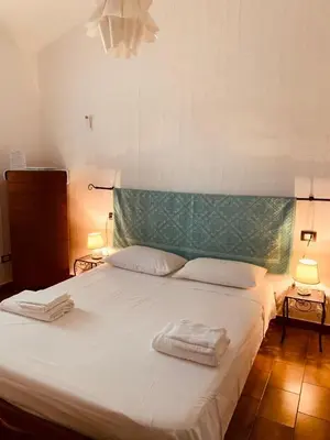 Letto o letti in una camera di VILLA ELEONORA