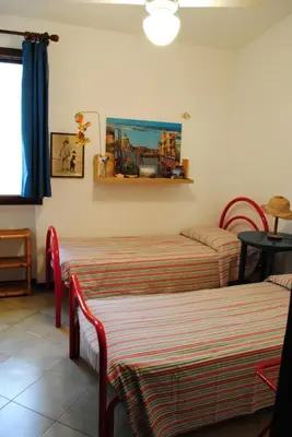 Letto o letti in una camera di Via dei pini