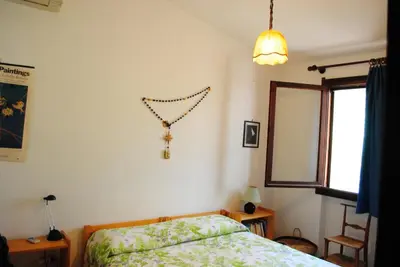 Letto o letti in una camera di Via dei pini