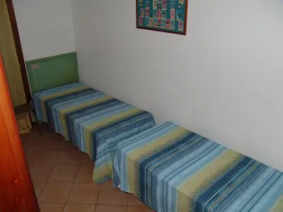 Letto o letti in una camera di Corallo Vacanze