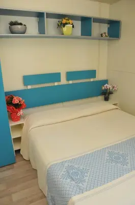 Letto o letti in una camera di Villaggio Camping Torre Salinas