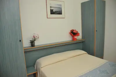 Letto o letti in una camera di Villaggio Camping Torre Salinas