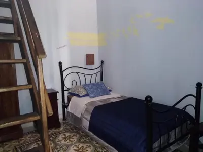 Letto o letti in una camera di La Corte di Lucina
