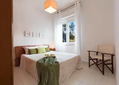 Letto o letti in una camera di SERENA HOME