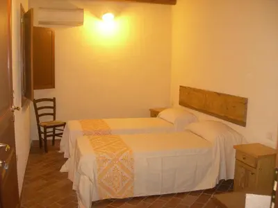 Letto o letti in una camera di Agriturismo Battaglia