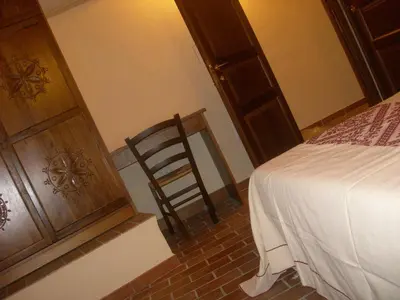Letto o letti in una camera di Agriturismo Battaglia