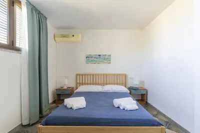 Letto o letti in una camera di Alisei Family House