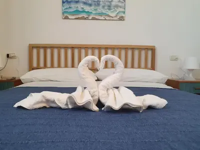 Letto o letti in una camera di Alisei Family House