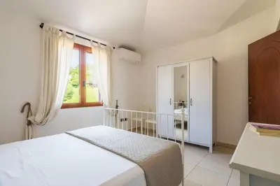 Letto o letti in una camera di Bilocale n 10 Arbatax vicino al mare
