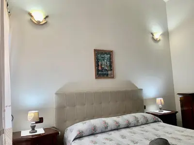 Letto o letti in una camera di casa vacanza V&G